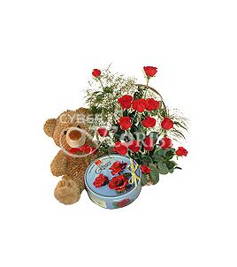 basket of red roses teddy bear and cookies. Kiev